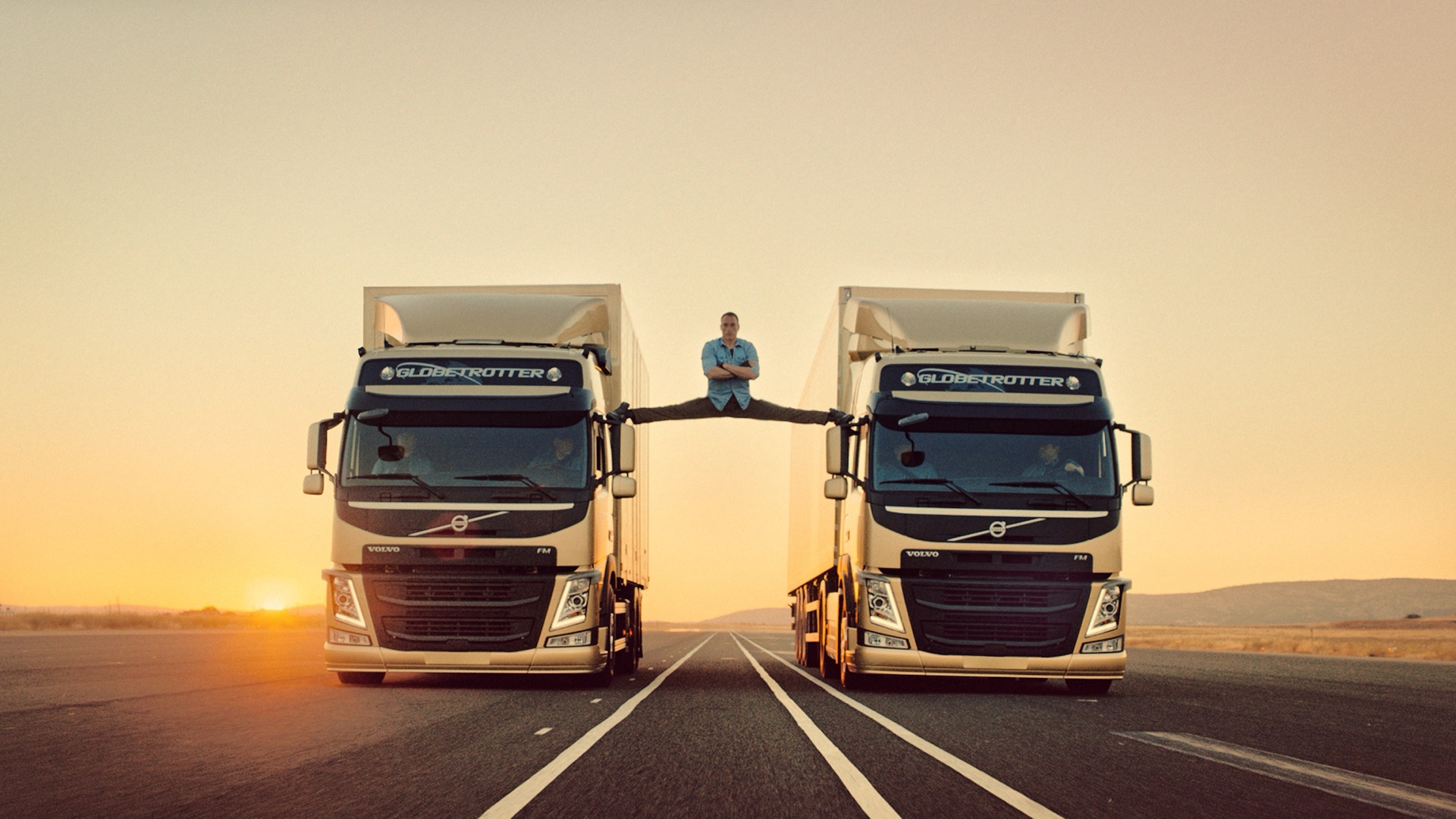 Jean-Claude Van Damme performing a split between two reversing Volvo trucks in The Epic Split.